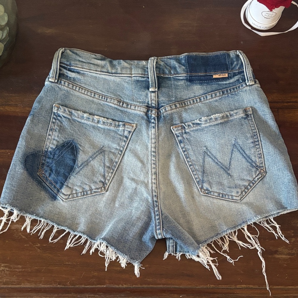 MOTHER Light Blue Distressed tomcat kick fray hearts
